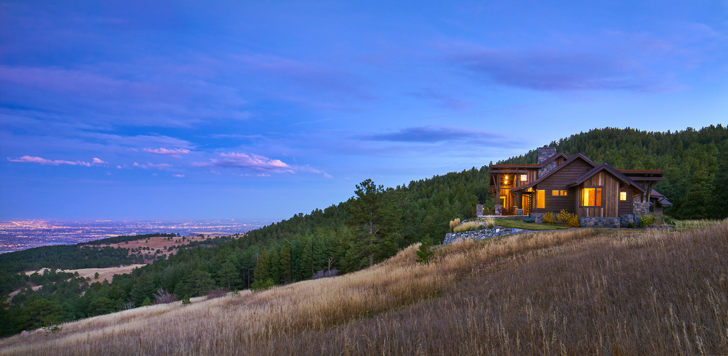 Strategies Used: Heavy timber, treated natural wood, and stone exterior materials; no flammable vegetation in defensible space Zone 1 and adequate spacing between trees in defensible space Zone 2. | Photo courtesy of TKP Architects.