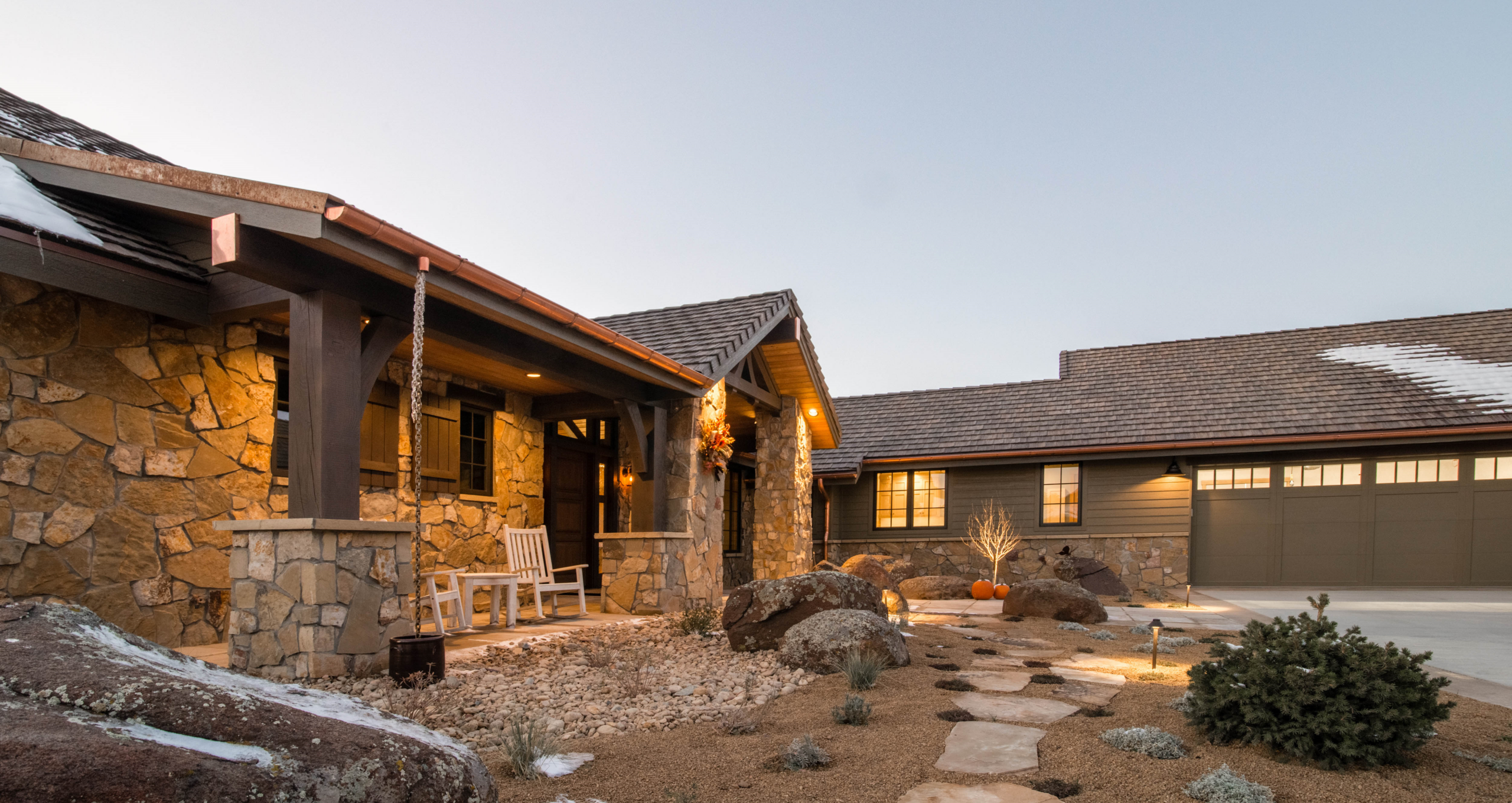 Strategies Used: Heavy timber, stone, & cementitious wood look siding materials; hardscape, stone & gravel landscaping